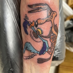 Wile E. Coyote catching Road Runner